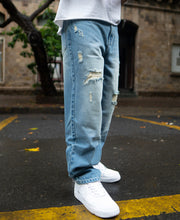 Blue Baggy Ripped Jeans.