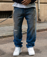 Dark Blue Baggy Distressed Jeans.