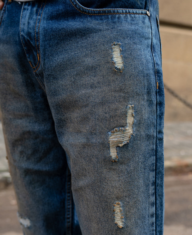Dark Blue Baggy Distressed Jeans.