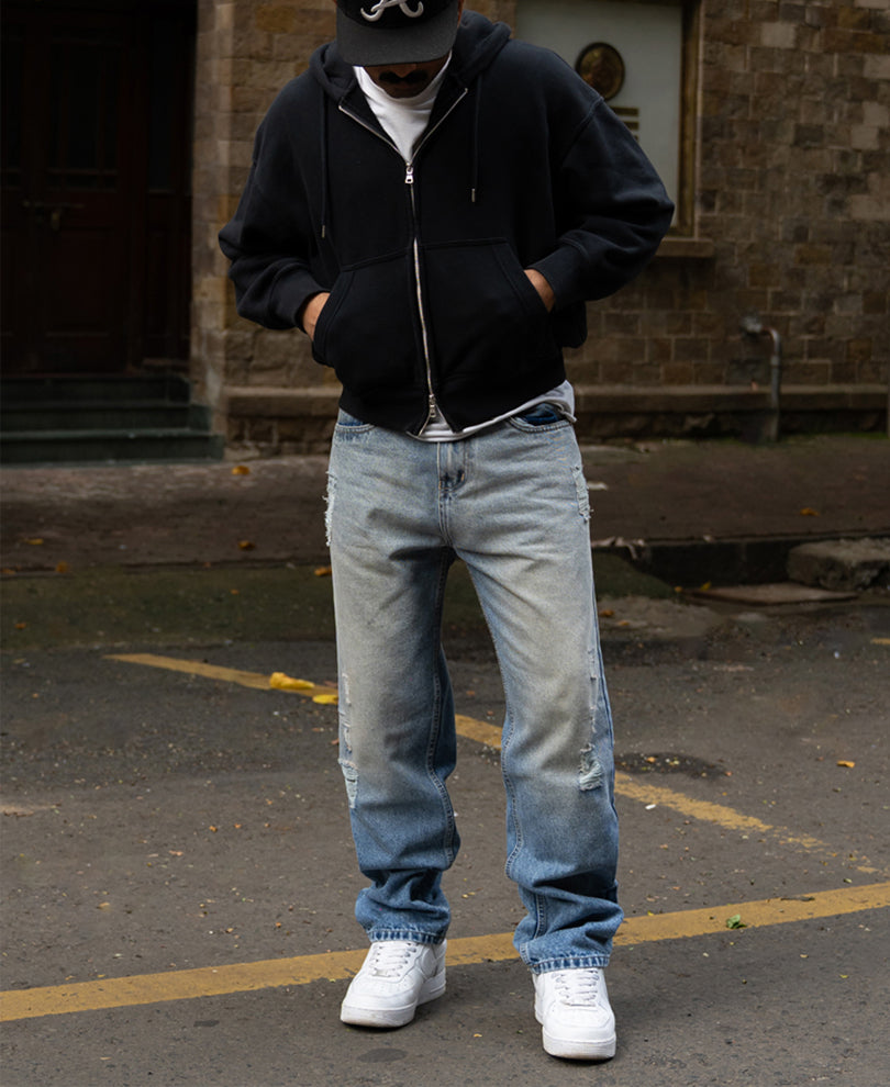 Mid Blue Baggy Distressed Jeans.