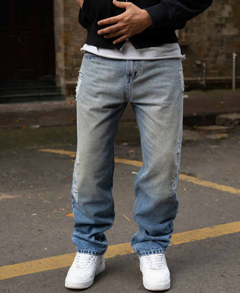 Mid Blue Baggy Distressed Jeans.