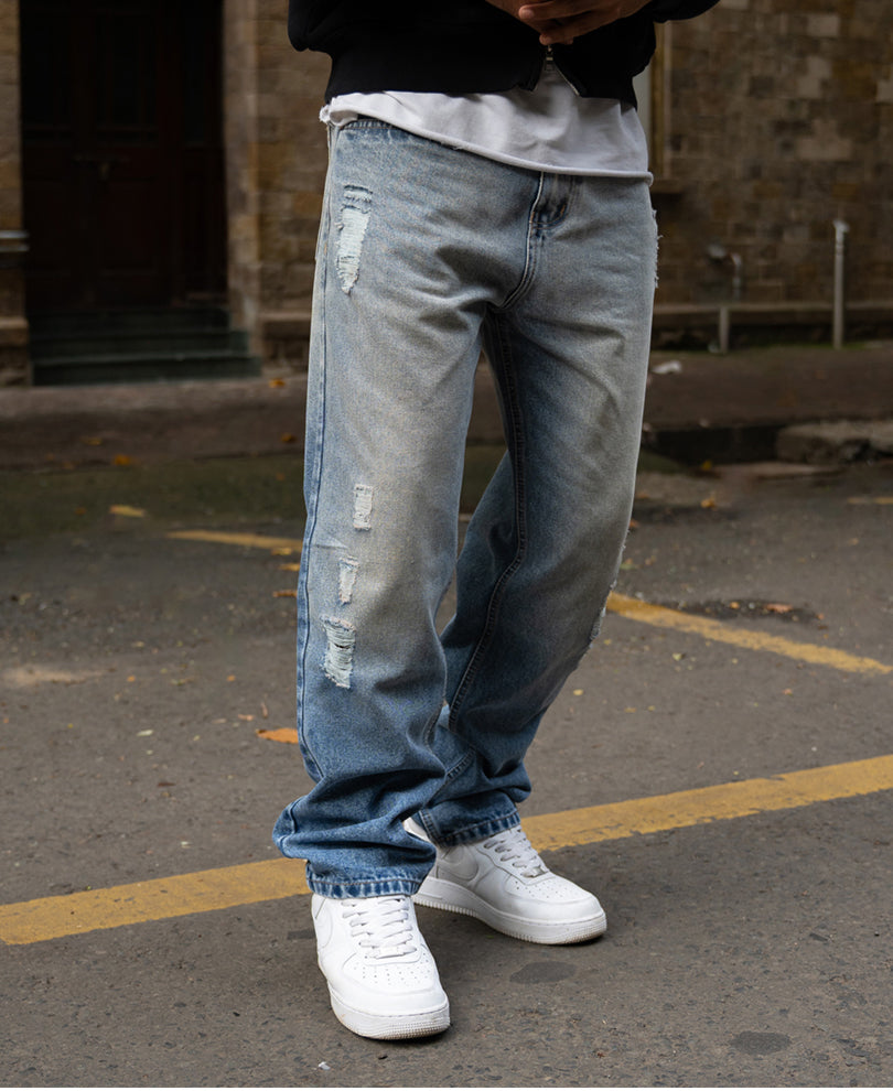 Mid Blue Baggy Distressed Jeans.