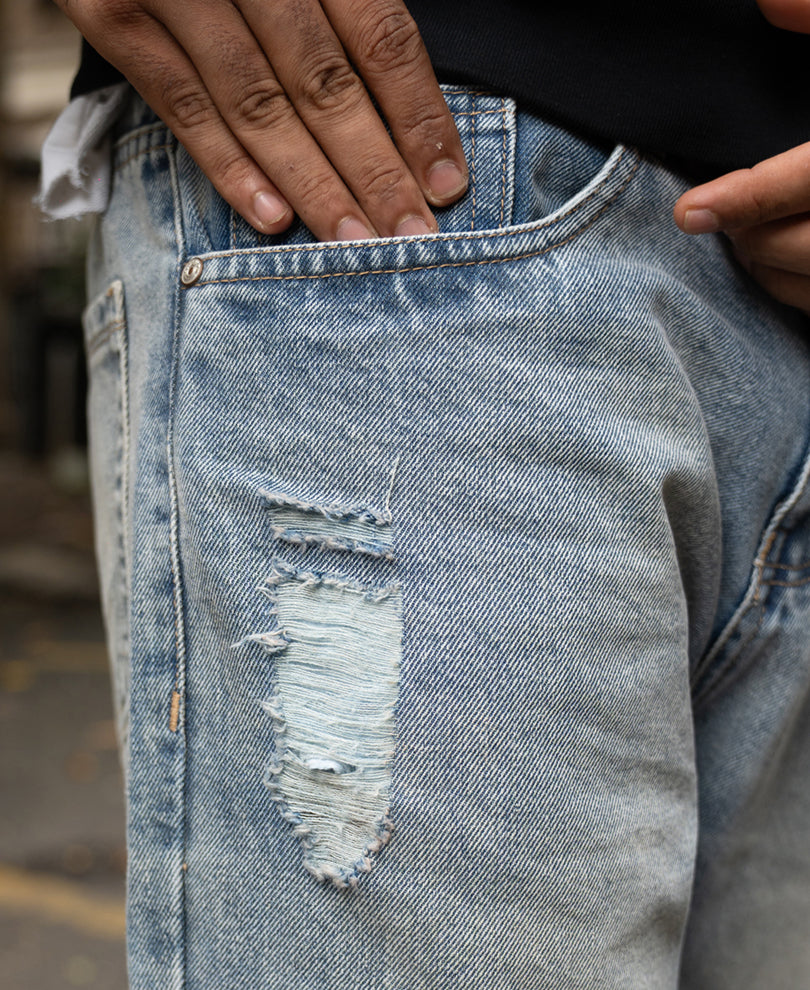 Mid Blue Baggy Distressed Jeans.