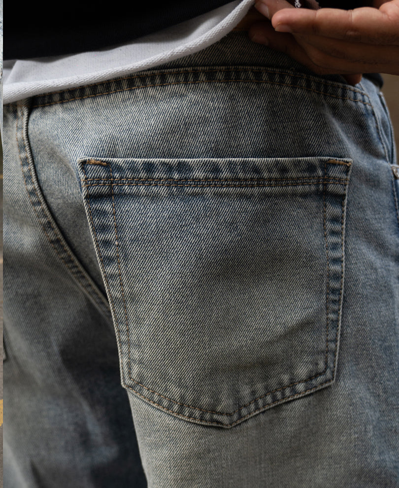 Mid Blue Baggy Distressed Jeans.
