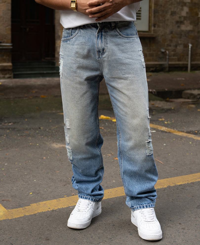 Mid Blue Baggy Distressed Jeans.